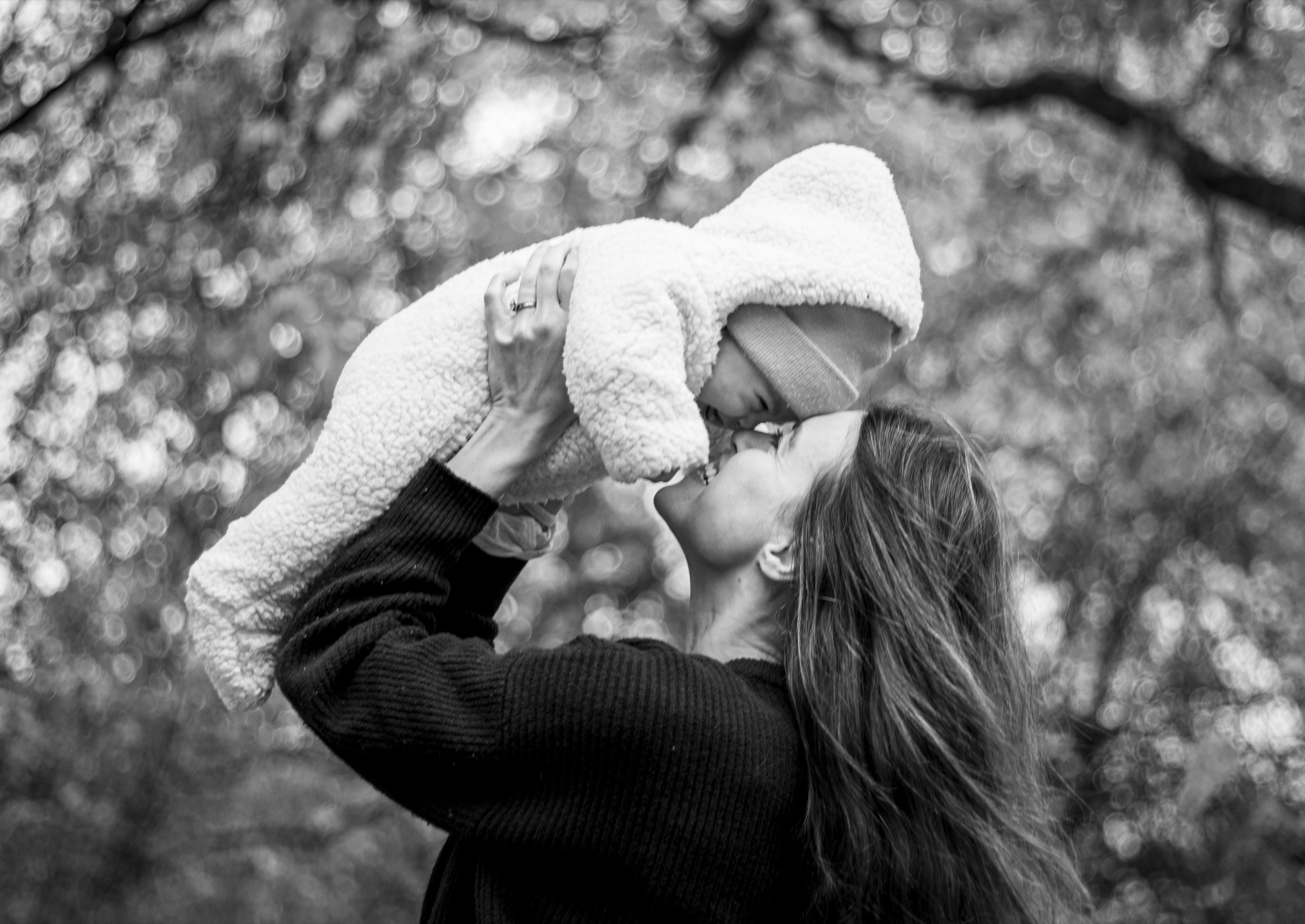 Mother holding baby smiling — family portrait photography by Katherine Lucas